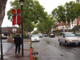 Motorcyclist walk in Solvang and Danish flag