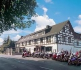 Motorcycle hotel with motorcycles parked outside